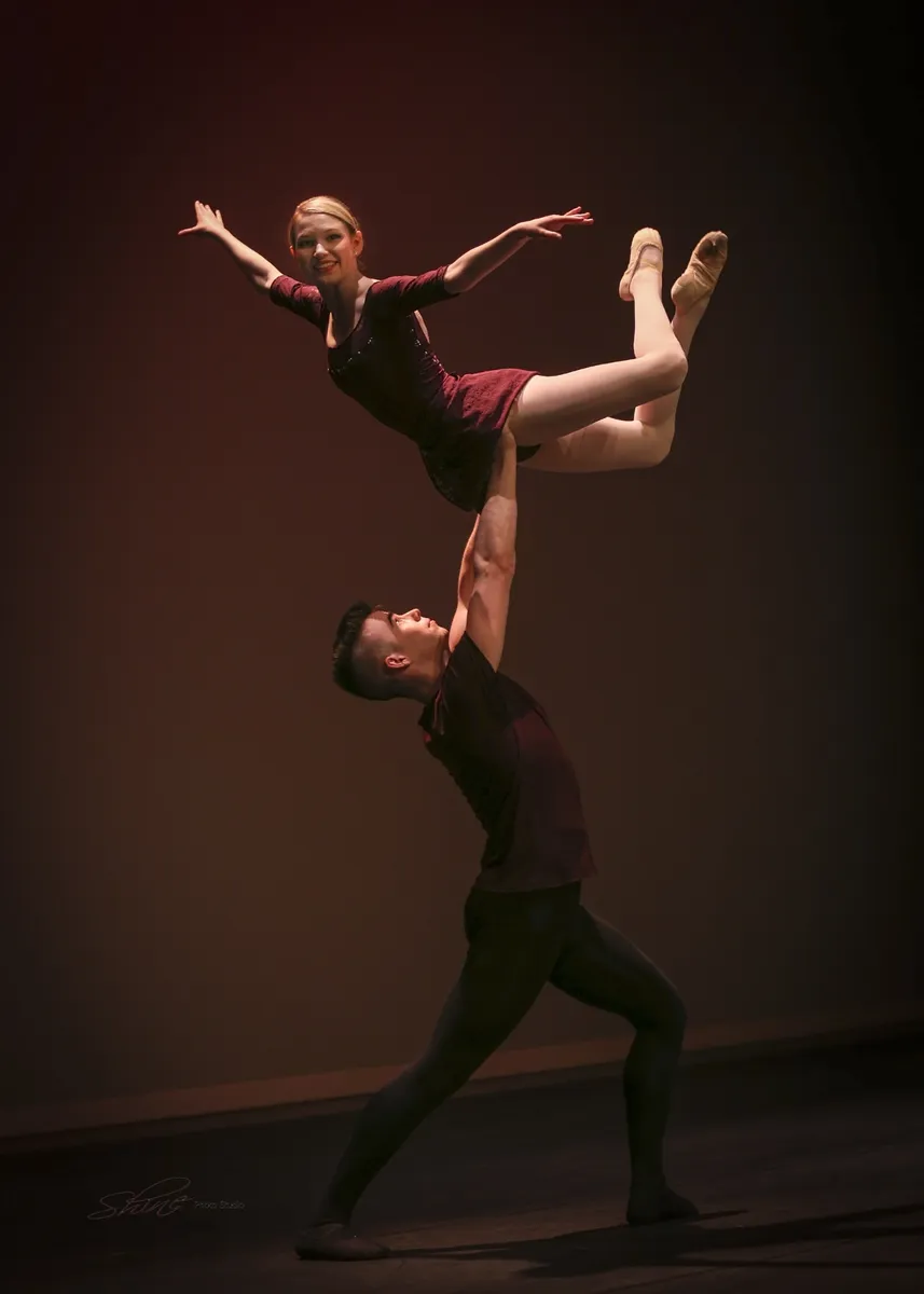 Two dancers performing in a Pas De Deux dance class
